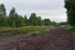 Het emplacement van Billingsfors, gezien vanaf de noordelijke kant, met op het spoor langs de losweg de T44 nr 344.
17-7-2015 19:38 The yard of Billingsfors, seen from the Northern side on 17-7-2015 at 19:38 with the T44 nr 344 besides the loading area. 