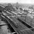 Twee bruine 2200 locomotieven aan de westzijde van Amsterdam CS bezien vanuit het Havengebouw rijden met een goederentrein over de bruggen van de westertoegang 05-09-1960 
Beeldmateriaal Het Utrechts Archief Nr. 154800 Two brown NS diesel locomotives (2200) are pulling a freight train over the western bridges of Amsterdam CS. Seen from the havengebouw.
Image from Het Utrechts Archief Nr. 154800