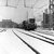 Op 14-2-1956 rijdt een bruine NS 2214 met een goederentrein een besneeuwd emplacement in Amsterdam over. 
Beeldmateriaal Het Utrechts Archief Nr. 166590 On 14-2-1956 a brown diesel engine (NS 2214) is driving on the snowy yard of Amsterdam with a freight train. 
Image from Het Utrechts Archief Nr. 166590