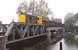 In 1981 rijdt de 2474 van de NS met een lange goederentrein in Amstelhoek (vlak bij Uithoorn) over de brug over de Amstel. 
 In 1981 a diesel engine type 2400 (nr 2474) is passing the bridge over the river 