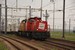 Twee 6400-en met een containertrein bij de Maasvlakte (Rotterdam) Two 6400 locomotives with a containertrain at the Maasvlakte (Rotterdam)