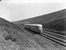 Een DEIII rijdt door de ingraving ter hoogte van Oosterbeek.
Rond 1938
Beeldmateriaal Het Utrechts Archief Nr. 151180 A diesel train unit type DEIII from the NS is driving at Oosterbeek. 
Around 1938
Image from Het Utrechts Archief Nr. 151180