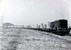 Diesellocomotief hippel 662 rijdt met een containertrein langs de Heijplaatweg in Rotterdam. 
Datering rond 1955
Beeldmateriaal Het Utrechts Archief Nr. 168384 Diesel engine Hippel nr 662 is driving next to the Heijplaatweg in Rotterdam with a containertrain. 
The date is around 1955.
Image from Het Utrechts Archief Nr. 168384