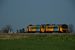 Op 26-4-2007 rijden twee Arriva Wadlopers (3115 en 3104) door het groene Groningse landschap op weg van Delfzijl of Roodeschool naar Groningen. 
15:48 On 26-4-2007 two DH1 diesel train units (Arriva Wadlopers 3115 and 3104) are driving through the green grasslands of Groningen on their trip from Delfzijl or Roodeschool to Groningen.
15:48