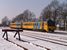 Op 5-3-2005 arriveert een Wadloper van NoordNed (DH2 3215) uit Groningen in een besneeuwd Zuidbroek. 
14:23 On 5-3-2005 a diesel train unit from NoordNed (DH2 Wadloper 3215) arrives from Groningen in Zuidbroek.
14:23