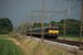 Op 25-6-2008 rijdt de 1767 om 17:14 uit Apeldoorn bij Teuge richting Deventer met een getrokken trein. 
Achteraan rijdt de 1833. On 25-6-2008 electric locomotive 1767 has just left Apeldoorn and is passing Teuge at 17:14 on its way to Deventer.
At the back of the train, was the NS 1833.