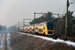 Een dubbeldekker (nr 8654) rijdt op 6 januari 2010 om 14:24 bij Wolfheze richting Arnhem door een licht besneeuwd landschap. A double decker train (Nr 8654) is heading for Arnhem on the 6th of Januari 2010 at 14:24 nearby Wolfheze through a little bit of snow. 