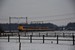 Op 7 januari 2009 rijden drie koploperstellen om 11:26 net onder het viaduct van de A50 door richting Zwolle bij Hattem.  On the 7th of Januari 2009 three train units (Koplopers) from NS are heading for Zwolle. 
They have just passed the overpass of highway A50 close to Hattem. 